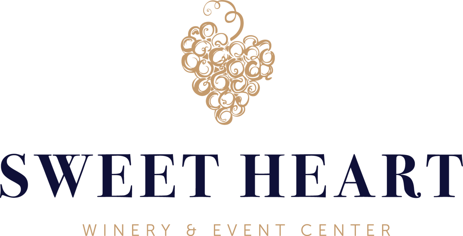 Logo with a gold grape cluster made of swirling lines above the words "SWEET HEART" in large navy blue text and "WINERY & EVENT CENTER" in smaller gold text underneath.